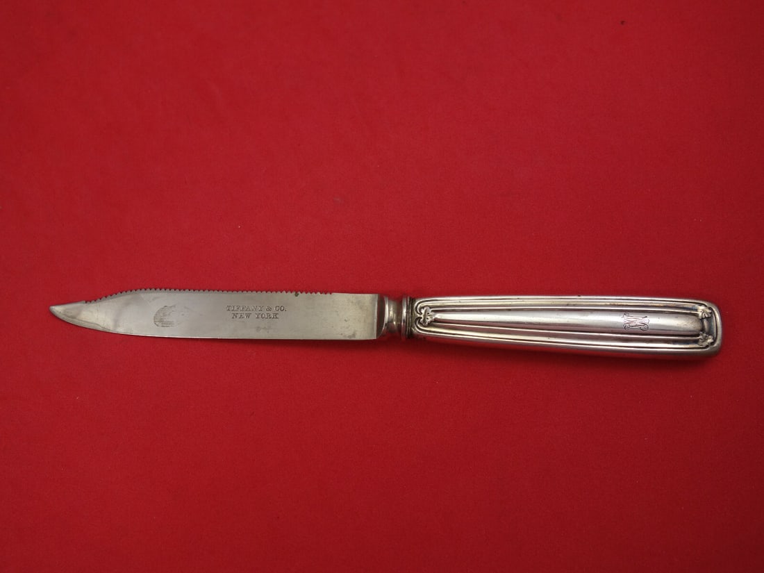 Tiffany & Co Saint Dunstan Sterling Silver Serrated Fruit Knife 7 1/4 inches: Tiffany & Co Saint Dunstan Sterling Silver Serrated Fruit Knife 7 1/4 inches This exquisite fruit knife, part of the Saint Dunstan pattern by Tiffany & Co., showcases the brand's signature craftsmansh