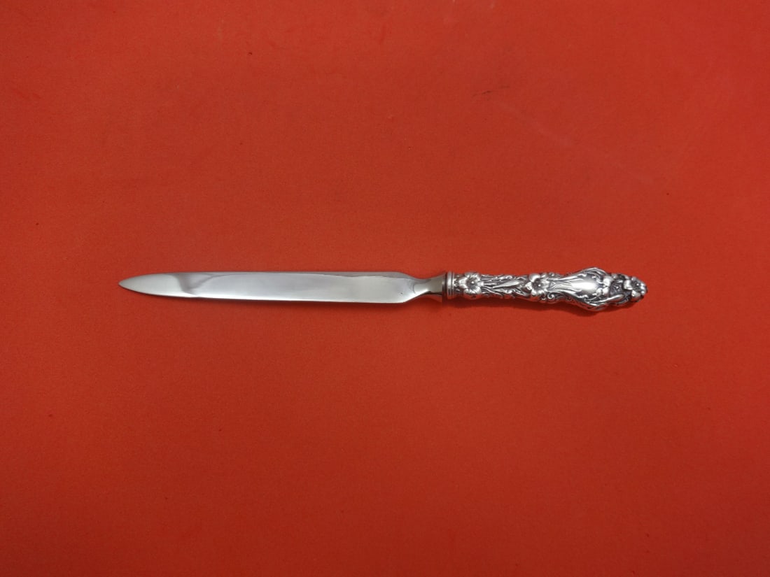 Whiting Lily Pattern Sterling Silver Custom Letter Opener 8": Whiting Lily Pattern Sterling Silver Custom Letter Opener 8" This exquisite letter opener is crafted in the iconic Lily pattern by Whiting, showcasing a sterling silver hollow handle with a stainless