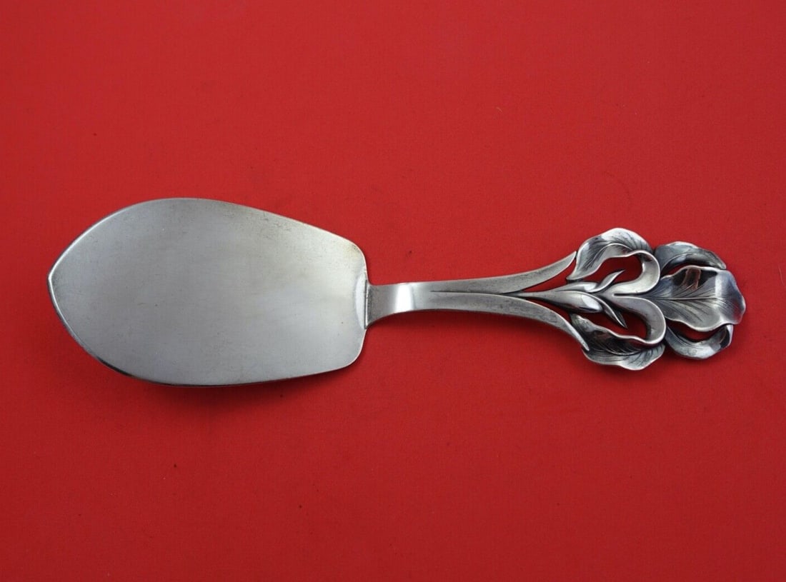 W & S Sorensen Sterling Silver Pastry Server with Iris Design 8 1/4": W & S Sorensen Sterling Silver Pastry Server with Iris Design 8 1/4" This exquisite pastry server by W & S Sorensen features a stunning flat handle adorned with an intricate iris design. Crafted from