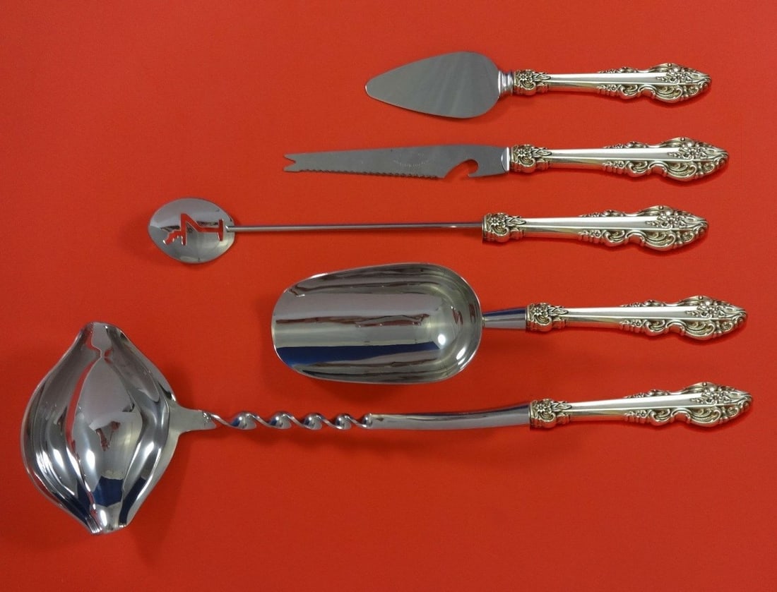 Reed & Barton El Greco Sterling Silver 5pc Cocktail Bar Set: Reed & Barton El Greco Sterling Silver 5pc Cocktail Bar Set Elevate your cocktail gatherings with this exquisite 5-piece El Greco Hostess Set by Reed & Barton, crafted in sterling silver. This custom-