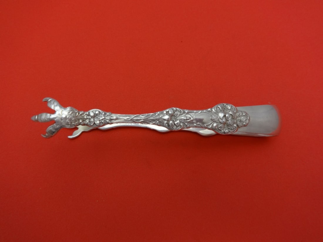 Alvin Gorham Old Orange Blossom Sterling Silver Sugar Tong 4 1/4": Alvin Gorham Old Orange Blossom Sterling Silver Sugar Tong 4 1/4" This exquisite Old Orange Blossom sugar tong, crafted by Alvin/Gorham, showcases the elegant design of the early 20th century. Made fr