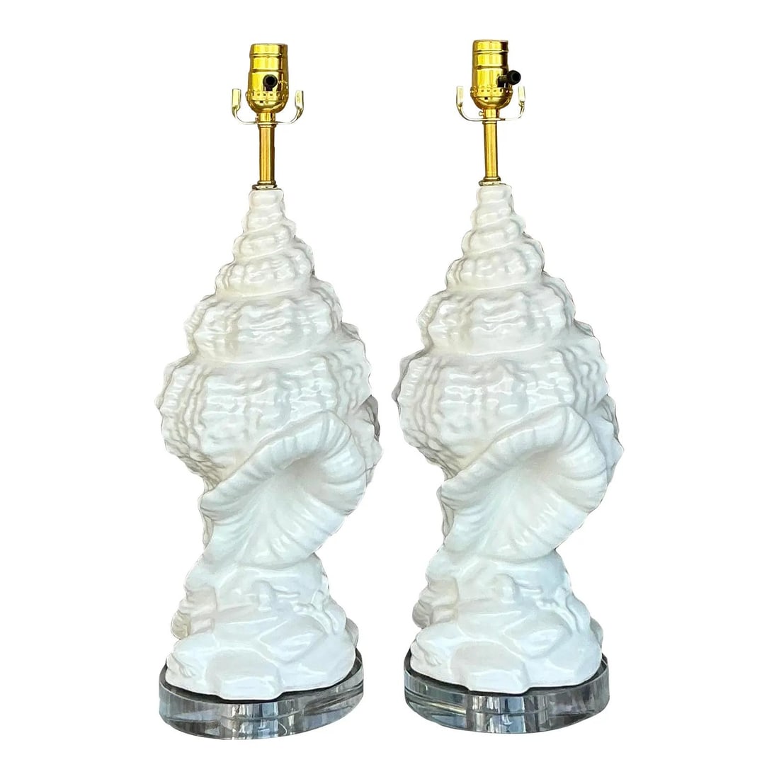 Vintage Coastal Glazed Ceramic Conch Lamps Pair with Brass Hardware: Vintage Coastal Glazed Ceramic Conch Lamps Pair with Brass Hardware Transform your space with this exquisite pair of Vintage Coastal Glazed Ceramic Conch Lamps. Each lamp is intricately sculpted to re