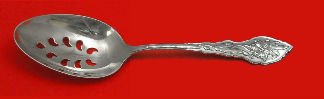 Unger Narcissus Sterling Silver Pierced Serving Spoon 9-Hole Custom 8 1/8": Unger Narcissus Sterling Silver Pierced Serving Spoon 9-Hole Custom 8 1/8" This exquisite serving spoon is crafted from sterling silver and features a beautifully designed Narcissus pattern by Unger.