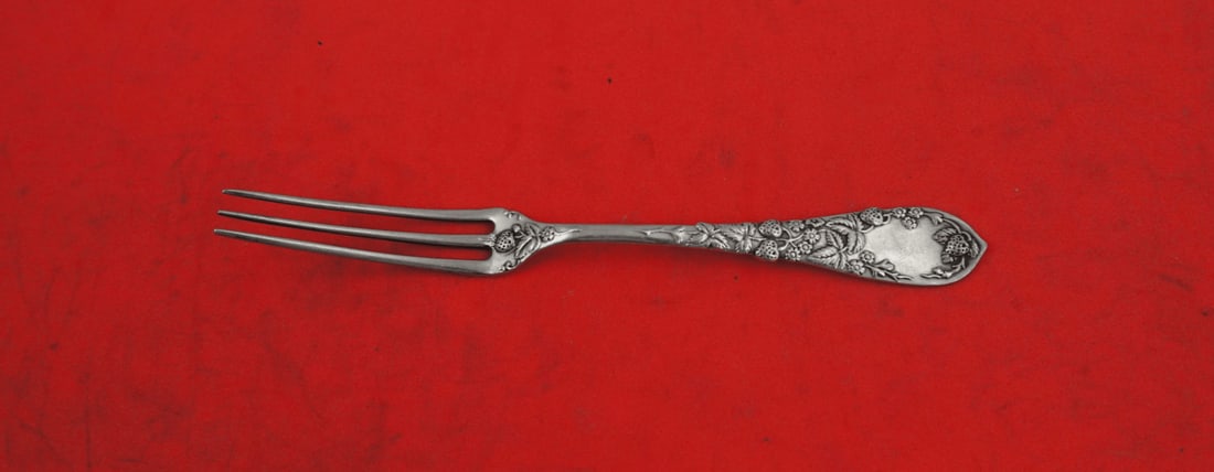 Durgin Strawberry Coin Silver Fork 4 3/4 Inches: Durgin Strawberry Coin Silver Fork 4 3/4 Inches This exquisite Strawberry Fork from Durgin showcases the elegant Strawberry pattern, crafted from high-quality Coin Silver (.900). Measuring 4 3/4 inche