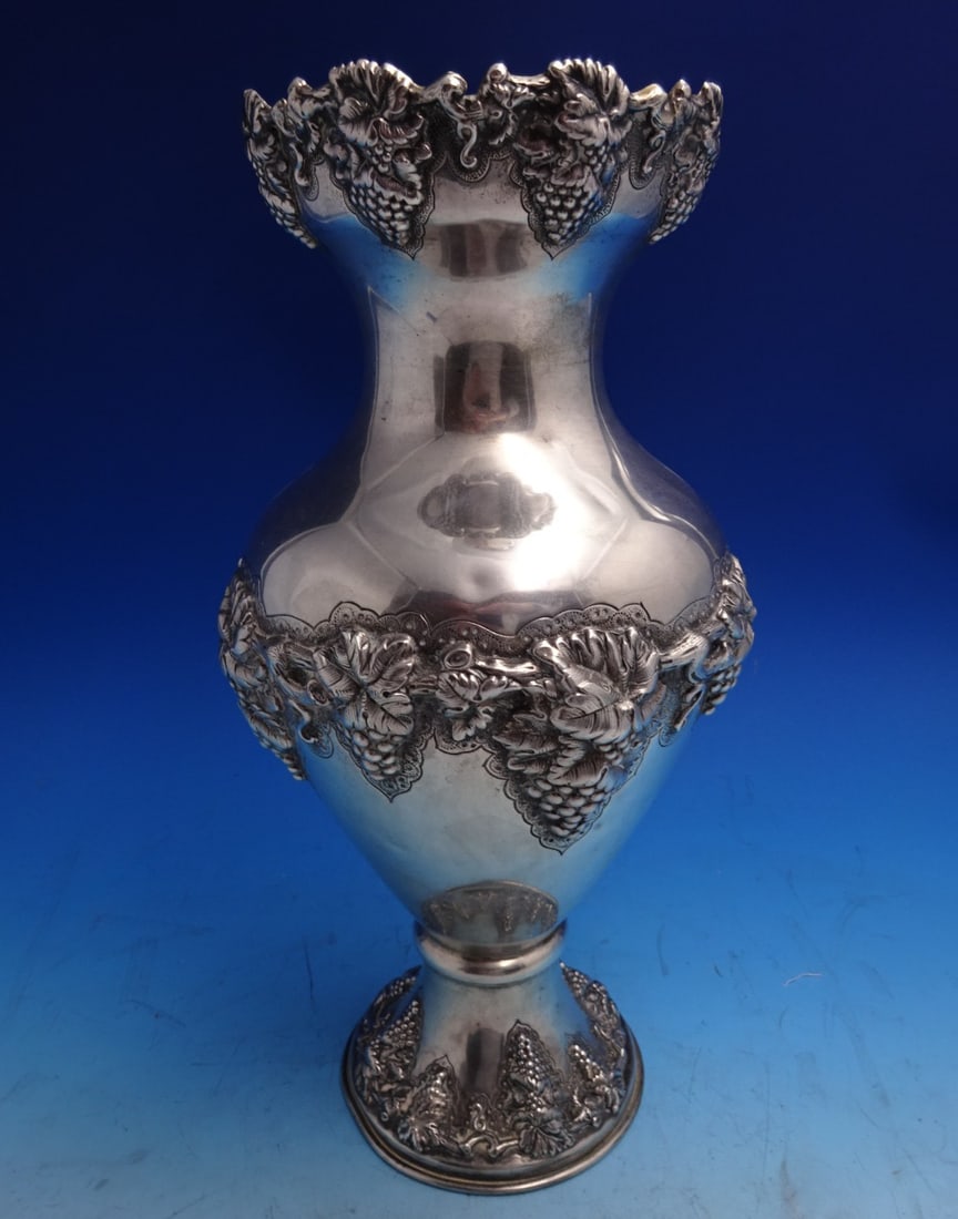 13 1/4" Italian Sterling Silver Vase with Grapevine Motif Gold Wash Interior: 13 1/4" Italian Sterling Silver Vase with Grapevine Motif Gold Wash Interior This Italian sterling silver vase features an elegant grapevine motif and a gold-washed interior. The vase stands 13 1/4 in