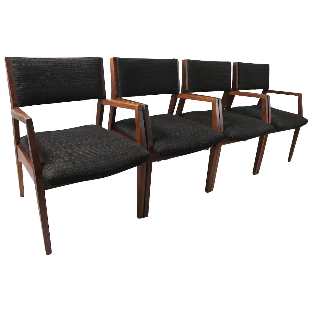 Set of 4 Mid Century Walnut Armchairs in Risom Style: Set of 4 Mid Century Walnut Armchairs in Risom Style This elegant set of four mid-century dining chairs showcases a timeless design inspired by Jens Risom. Crafted from solid walnut, these armchairs f