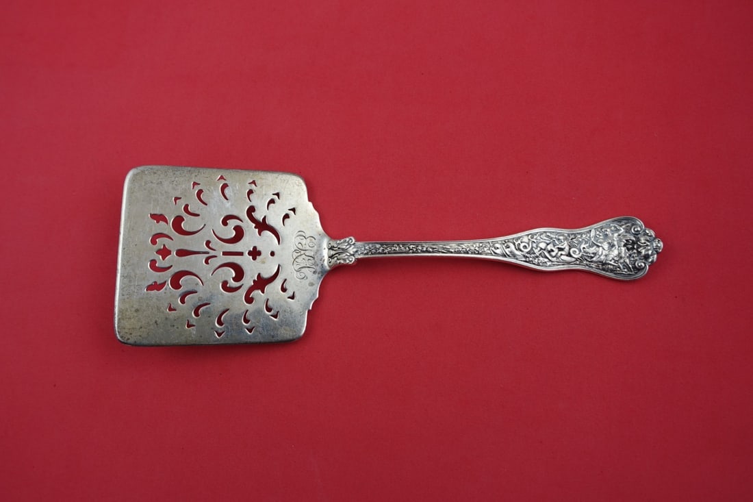 Tiffany & Co Olympian Sterling Silver Waffle Server 8 inch: Tiffany & Co Olympian Sterling Silver Waffle Server 8 inch This exquisite Waffle Server from the Olympian pattern by Tiffany & Co. showcases the elegance of sterling silver craftsmanship. Measuring 8