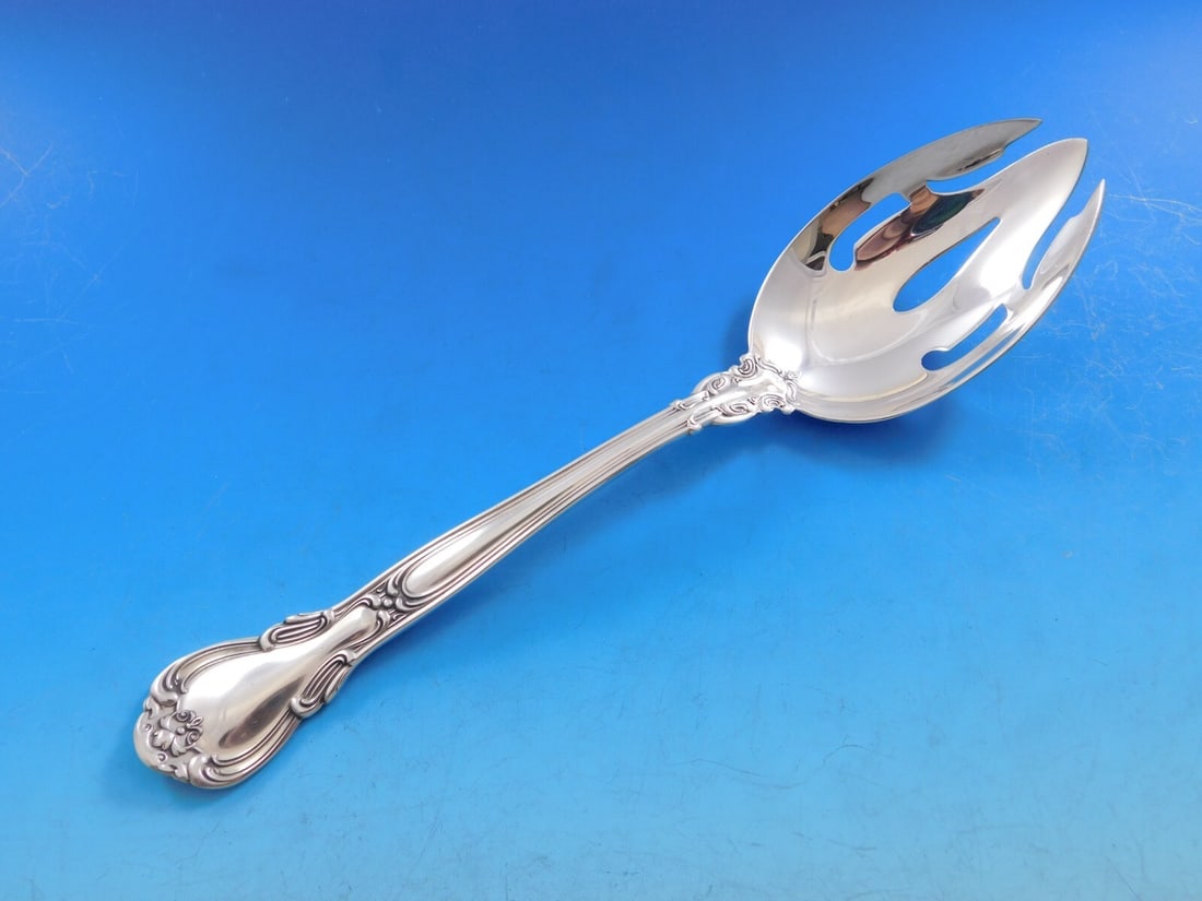 Gorham Chantilly Sterling Silver Slotted Serving Spoon 8 3/8": Gorham Chantilly Sterling Silver Slotted Serving Spoon 8 3/8" Presenting the Chantilly by Gorham Sterling Silver Serving Spoon, a beautifully crafted piece from the renowned Gorham brand. This slotted