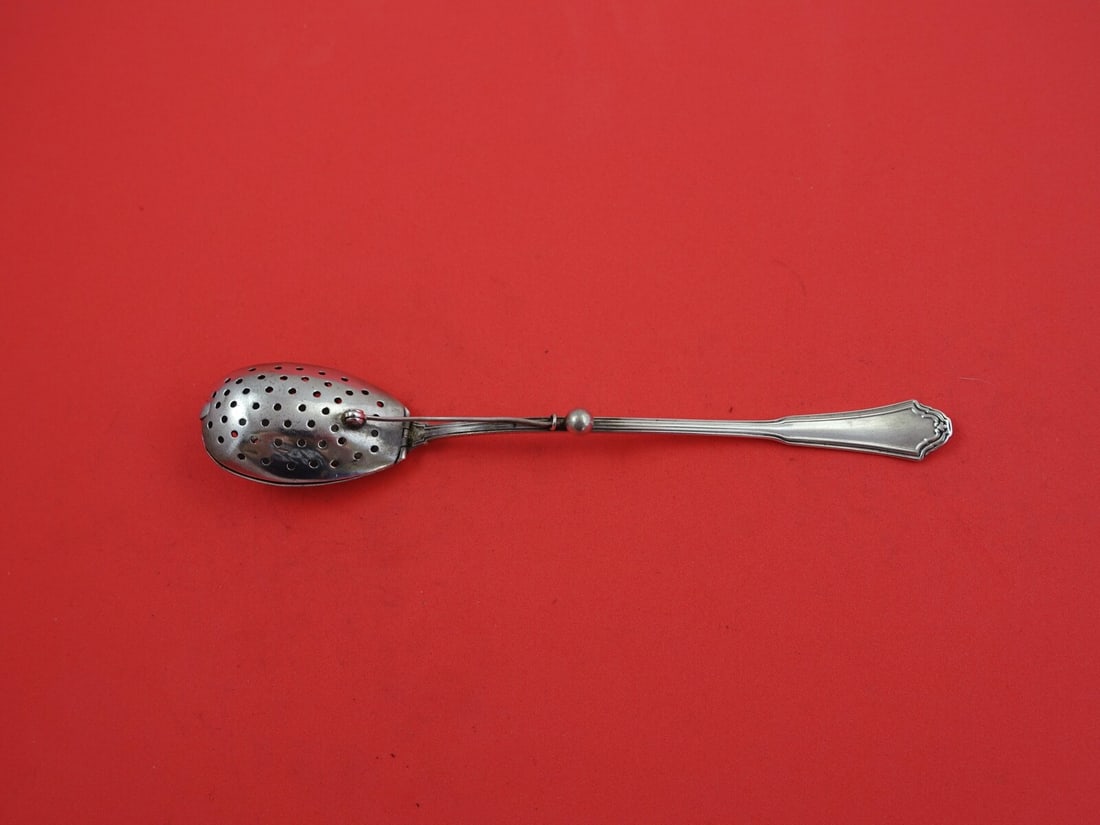 Reed and Barton Jacobean Sterling Silver Tea Infuser Spoon 7 1/4": Reed and Barton Jacobean Sterling Silver Tea Infuser Spoon 7 1/4" This exquisite Jacobean tea infuser spoon by Reed & Barton is crafted from high-quality sterling silver, showcasing a timeless design