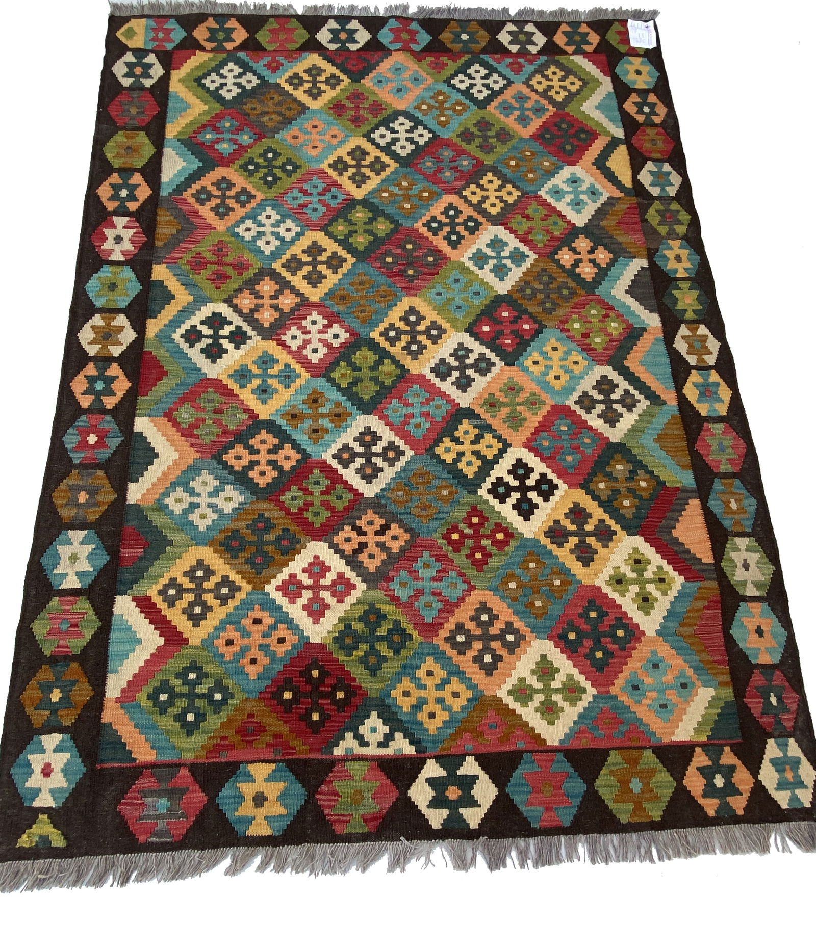 5' x 7' Handcrafted Multi-Color Brown Kilim Rug with Magenta Accents: 5' x 7' Handcrafted Multi-Color Brown Kilim Rug with Magenta Accents Free continental US Shipping Enhance your home decor with this stunning 5' x 7' Multi-Color Brown Kilim Rug. Handcrafted with preci