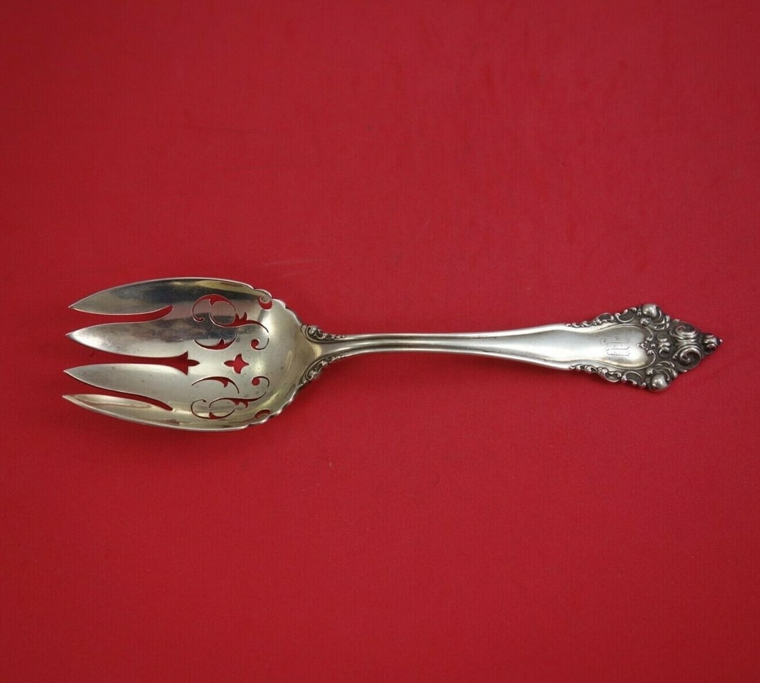 Reed and Barton La Splendide Sterling Silver Serving Fork 8 7/8": Reed and Barton La Splendide Sterling Silver Serving Fork 8 7/8" Presenting the exquisite La Splendide vegetable serving fork by Reed and Barton, crafted from high-quality sterling silver. This elegan