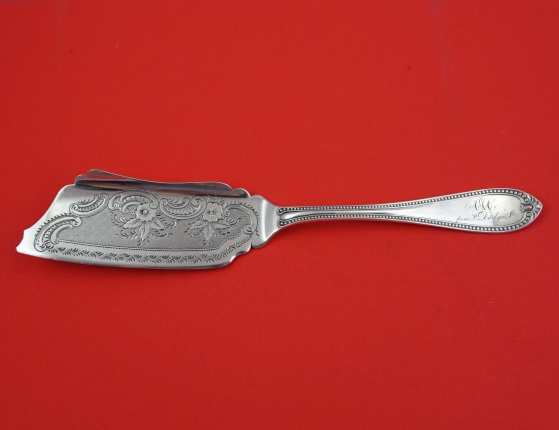 Bennett & Bro Bead Coin Silver Ice Cream Slice 10.5 Inch: Bennett & Bro Bead Coin Silver Ice Cream Slice 10.5 Inch This exquisite ice cream slice from Bennett & Bro showcases the elegant Bead pattern, crafted from high-quality Coin Silver (.900). Measuring 1