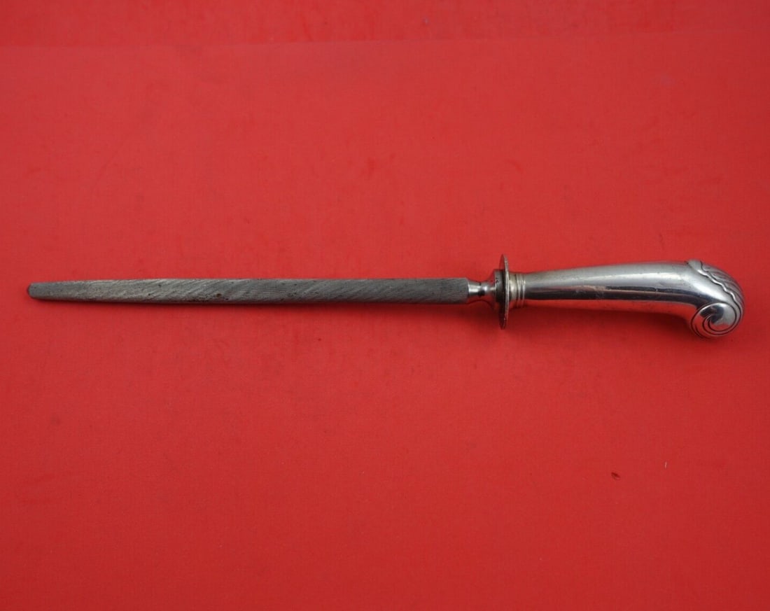 Stieff Williamsburg Shell Sterling Silver 12 Inch Roast Hone: Stieff Williamsburg Shell Sterling Silver 12 Inch Roast Hone This exquisite roast hone is crafted by Stieff in the elegant Williamsburg Shell pattern. Made of sterling silver, it features a hollow han