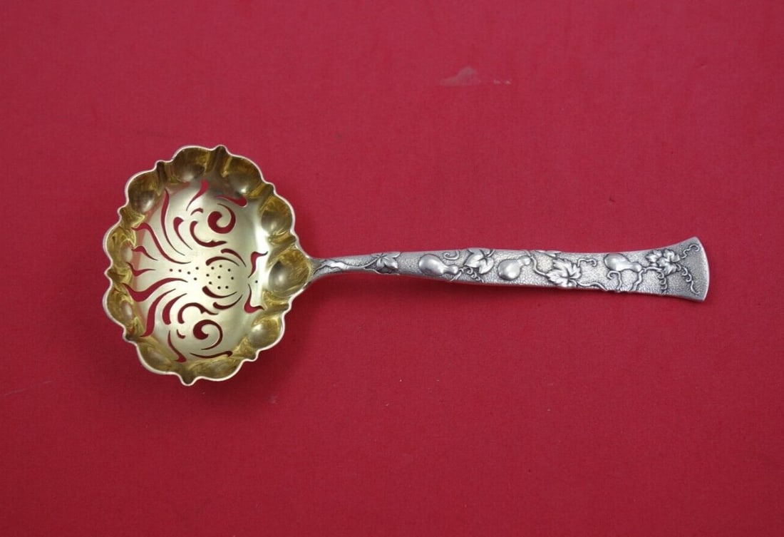 Tiffany & Co. Vine Sterling Silver Sugar Sifter Gourd Motif 6.125": Tiffany & Co. Vine Sterling Silver Sugar Sifter Gourd Motif 6.125" Discover a stunning piece from Tiffany & Co.'s renowned Vine collection, featuring a sterling silver sugar sifter with an ornate gold
