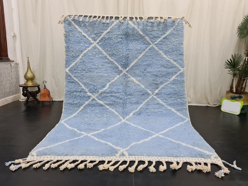 Authentic Handwoven Moroccan Berber Rug Soft Light Blue 8 x 5 Feet: Authentic Handwoven Moroccan Berber Rug Soft Light Blue 8 x 5 Feet Enhance your living space with this authentic soft light blue handwoven Moroccan Berber area rug. Featuring a stunning geometric whit