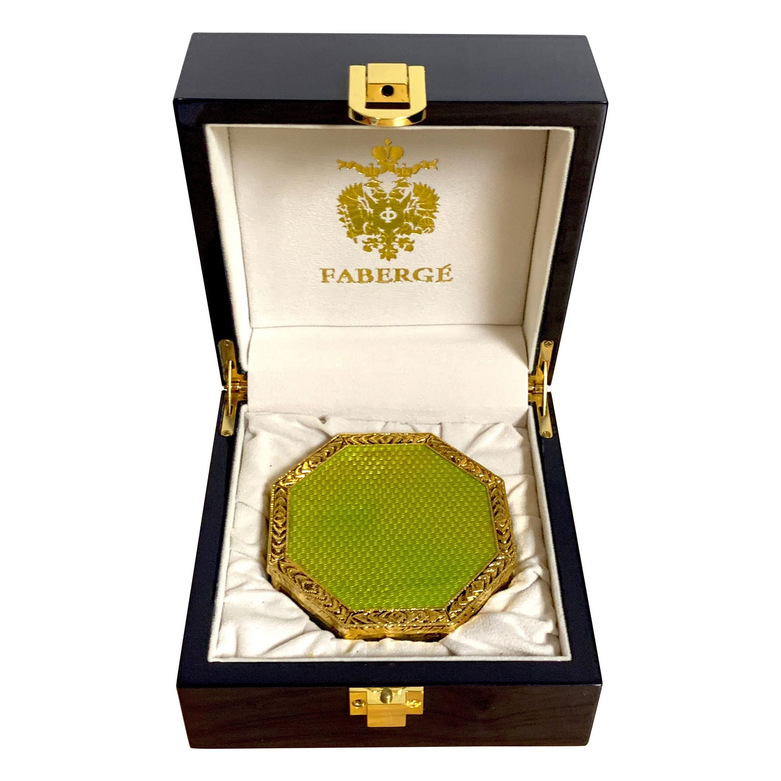 Neoclassical Green Guilloche Ormolu Box after Faberge 1990s: Neoclassical Green Guilloche Ormolu Box after Faberge 1990s This exquisite Neoclassical octagonal box features a stunning green Guilloche design complemented by elegant ormolu accents, reminiscent of