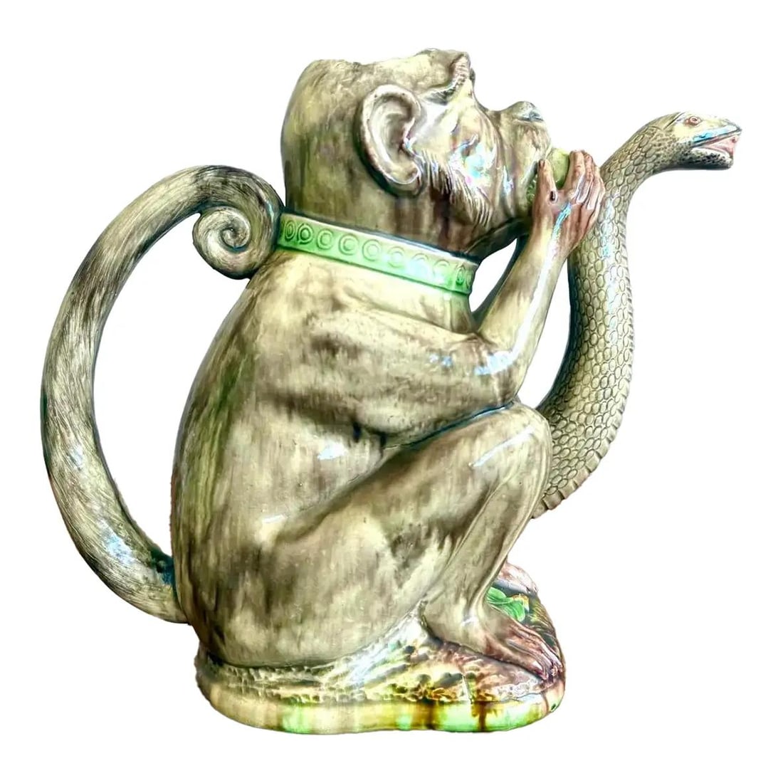 Majolica-Style Monkey Cobra Ceramic Pitcher Unique Boho Decor: Majolica-Style Monkey Cobra Ceramic Pitcher Unique Boho Decor This stunning late 20th-century ceramic pitcher showcases a playful design featuring a wide-eyed monkey and a dramatic cobra that forms th