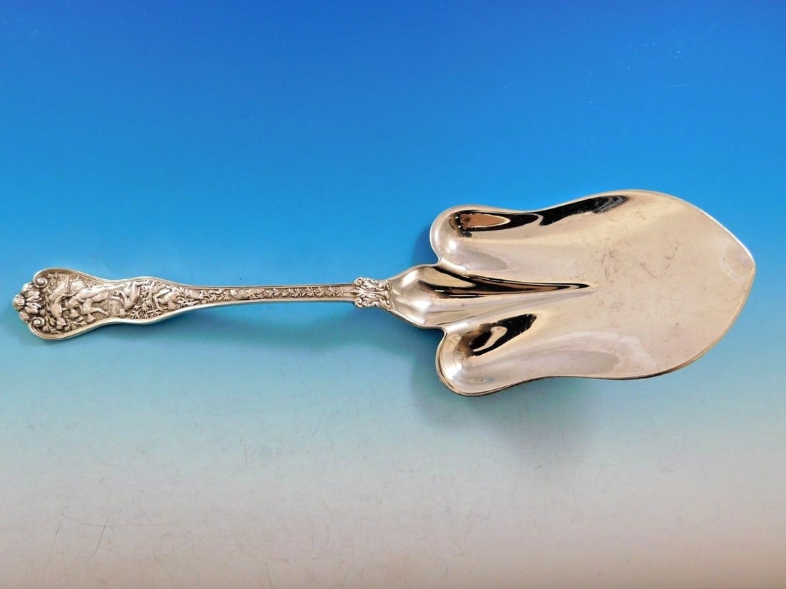 Tiffany & Co Olympian Sterling Silver Pastry Server 10.5 inches Spade Shape: Tiffany & Co Olympian Sterling Silver Pastry Server 10.5 inches Spade Shape Experience the exquisite craftsmanship of the Olympian pattern by Tiffany & Co. This stunning sterling silver pastry server