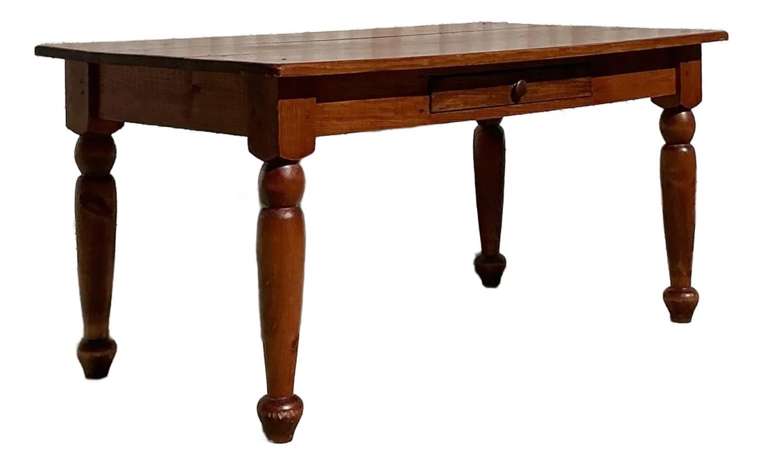Vintage Boho Farm Table with Turned Legs and Center Drawer: Vintage Boho Farm Table with Turned Legs and Center Drawer This vintage farm table beautifully embodies classic boho charm with its warm, rich wood grain and elegantly turned legs. Crafted with sturdy