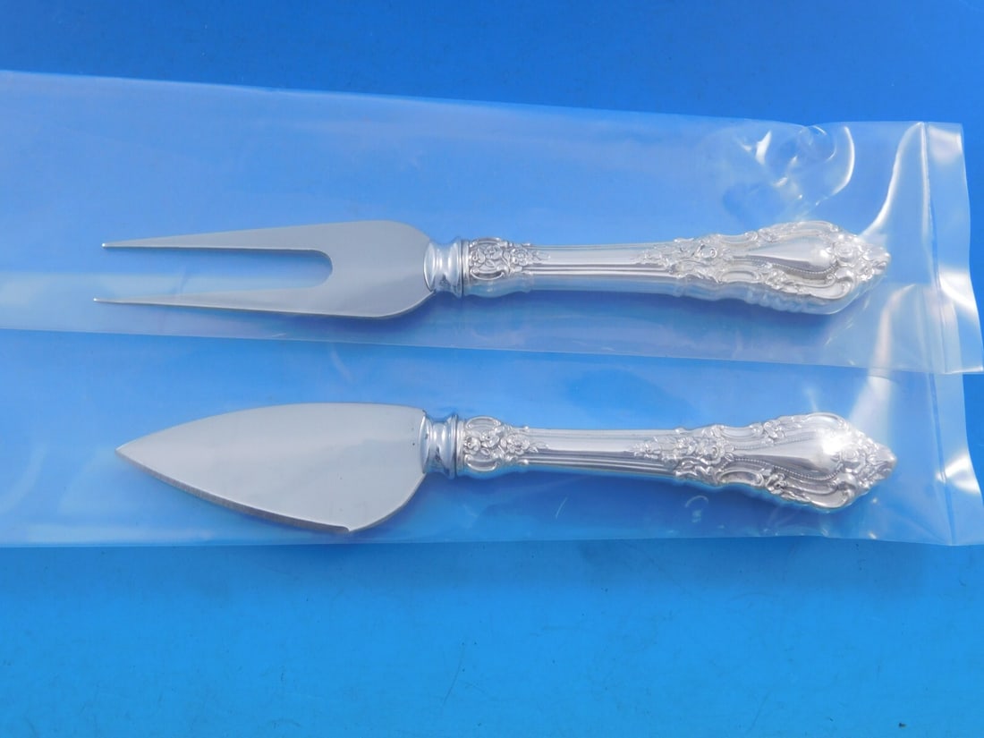 Eloquence by Lunt Sterling Silver Cheese Serving Set 2-piece: Eloquence by Lunt Sterling Silver Cheese Serving Set 2-piece Elevate your cheese serving experience with this exquisite 2-piece Eloquence by Lunt Sterling Silver Hard Cheese Serving Set. Crafted from