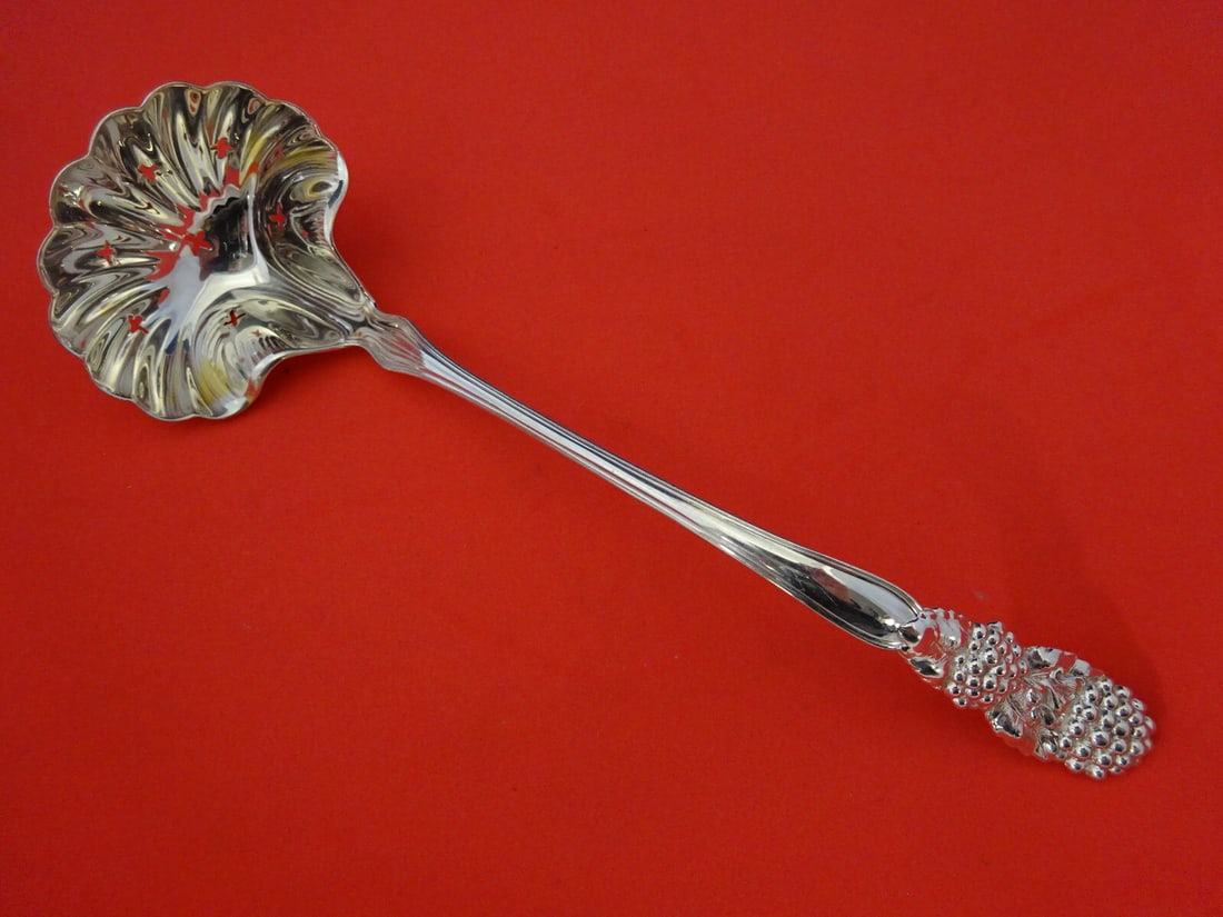 Tiffany & Co Blackberry Sterling Silver Sugar Sifter Ladle 7 1/4": Tiffany & Co Blackberry Sterling Silver Sugar Sifter Ladle 7 1/4" This exquisite sugar sifter ladle from Tiffany & Co. features the elegant Blackberry pattern. Crafted from high-quality sterling silve