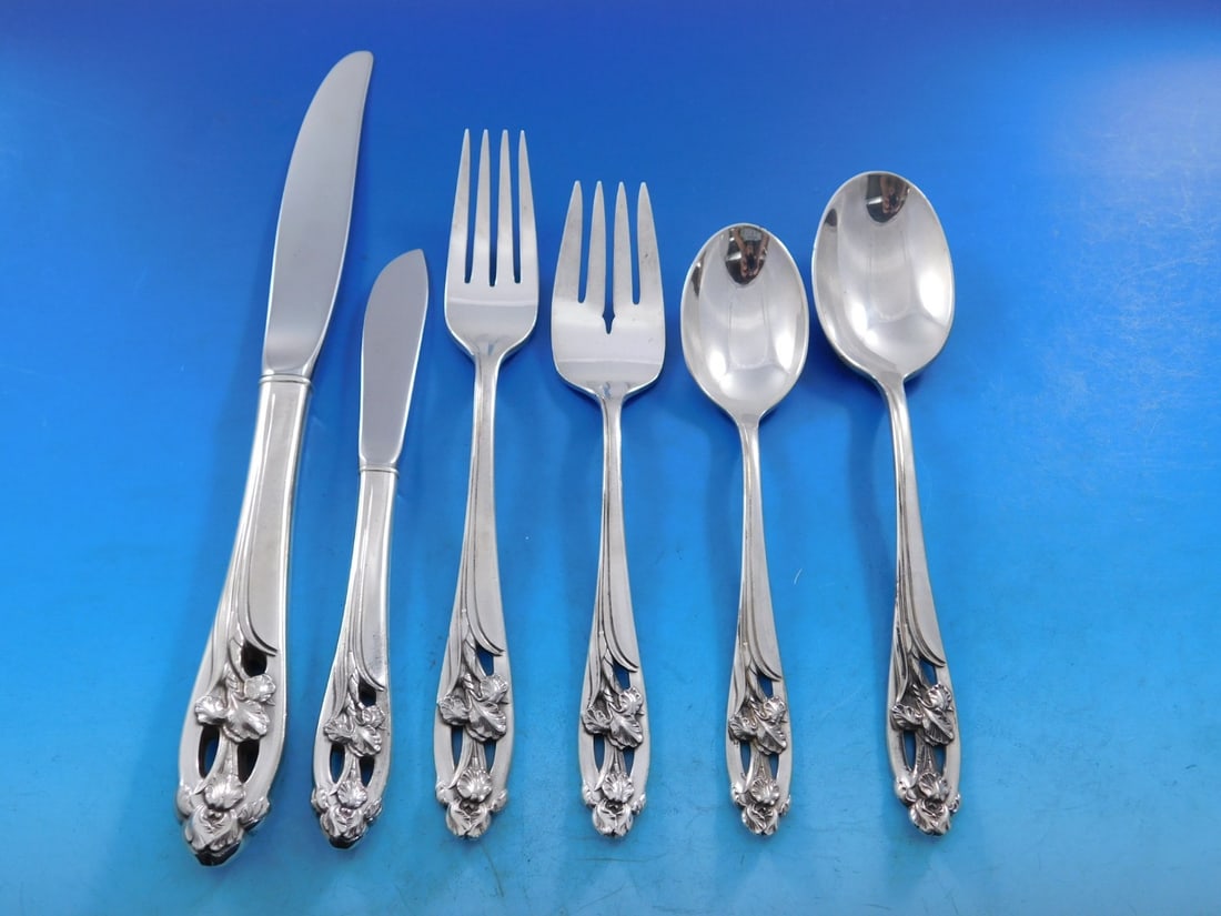 International Silver Silver Iris Flatware Set for 12 82 Pieces: International Silver Silver Iris Flatware Set for 12 82 Pieces Enhance your dining experience with the Silver Iris flatware set from International Silver, designed to serve 12 guests with elegance. Th
