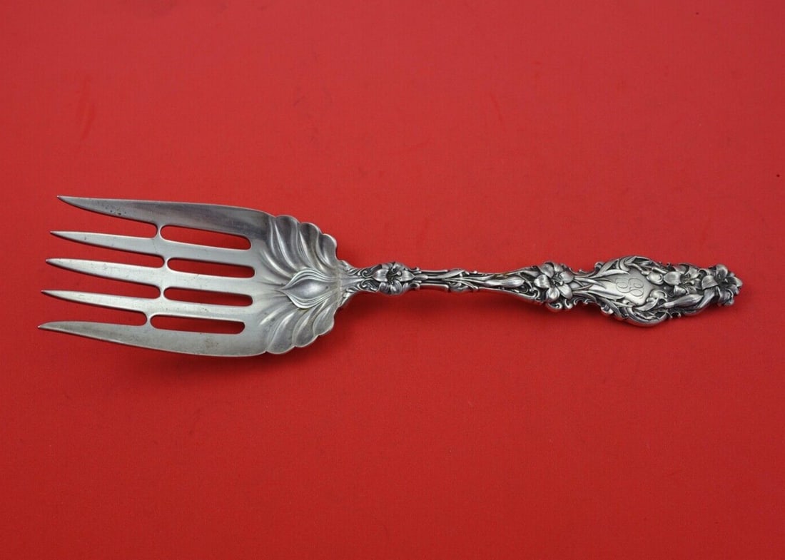 Whiting Lily Sterling Silver 5-Tine Fish Serving Fork 9": Whiting Lily Sterling Silver 5-Tine Fish Serving Fork 9" This exquisite serving fork is crafted from sterling silver (.925) in the elegant Lily pattern by Whiting. Measuring 9 inches, it features a 5-