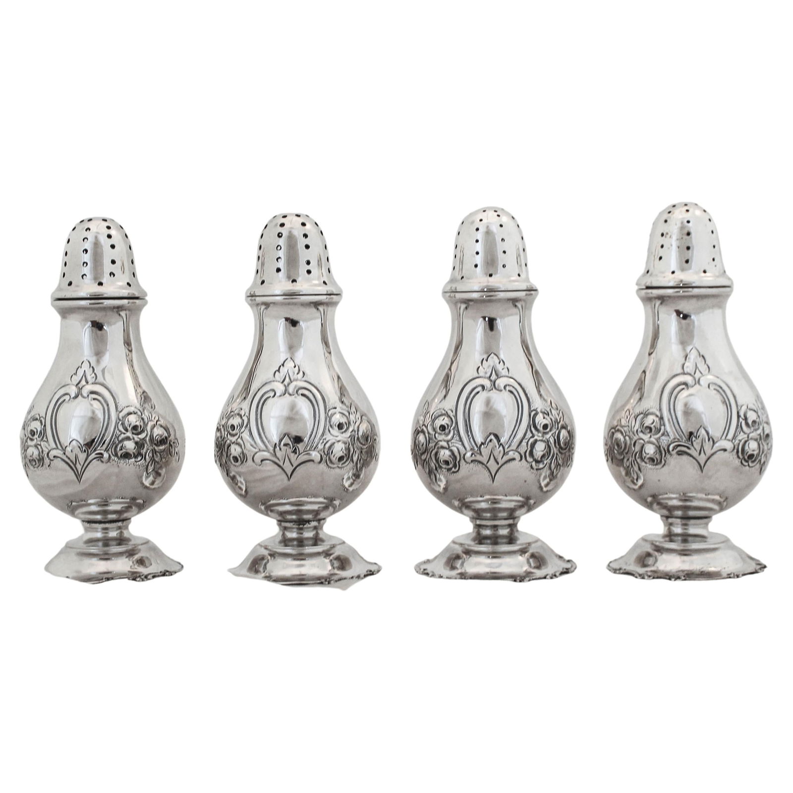 Set of 4 Antique Sterling Silver Salt Shakers Austria 1900-1909: Set of 4 Antique Sterling Silver Salt Shakers Austria 1900-1909 This exquisite set of four sterling silver salt shakers showcases the craftsmanship of the early 20th century, specifically from the Aus