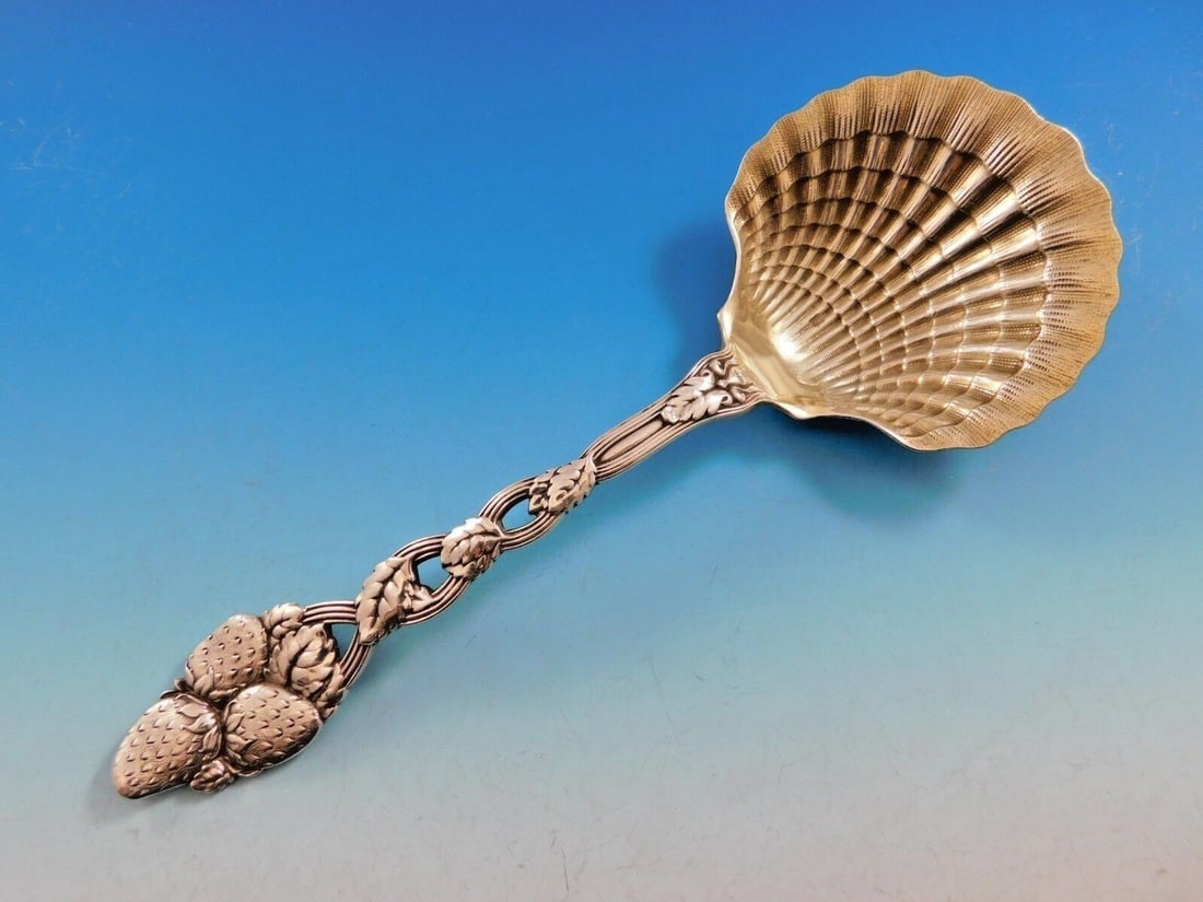 Tiffany & Co Strawberry Vine Sterling Silver Spoon 9" Clam Shell: Tiffany & Co Strawberry Vine Sterling Silver Spoon 9" Clam Shell This exquisite Strawberry Vine Serving Spoon by Tiffany & Co. is a stunning example of craftsmanship from the late 19th century. Crafte