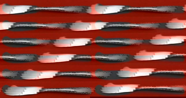 Gorham Camellia Sterling Silver Butter Spreaders Set of 12: Gorham Camellia Sterling Silver Butter Spreaders Set of 12 Add elegance to your dining experience with this stunning 12-piece set of butter spreaders in the Camellia pattern by Gorham. Crafted from hi