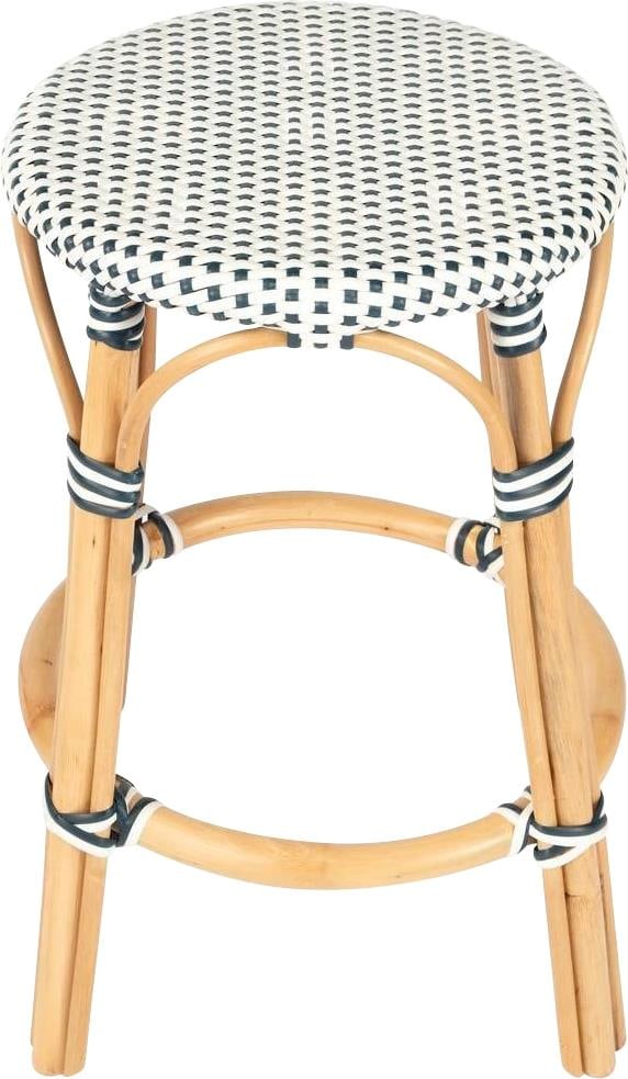 Butler Navy Dot Round Rattan Counter Stool with Blue Finish: Butler Navy Dot Round Rattan Counter Stool with Blue Finish Enhance your coastal decor with this elegant Navy Dot Coastal Rattan Stool. Featuring a sturdy natural rattan frame with a stylish blue fini