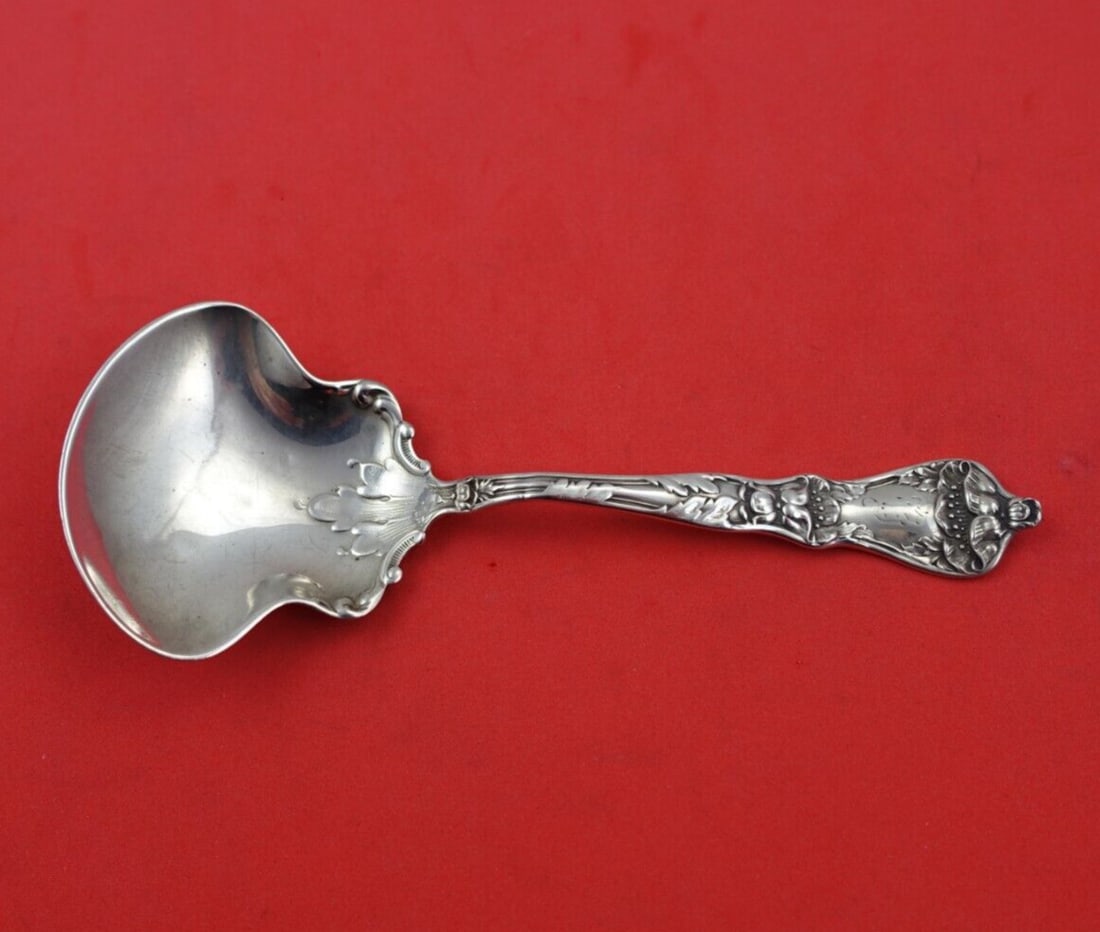 Manchester Poppy Sterling Silver Preserve Spoon 5 1/8 Inch Monogrammed: Manchester Poppy Sterling Silver Preserve Spoon 5 1/8 Inch Monogrammed This exquisite serving spoon is part of the Poppy pattern by Manchester, crafted from high-quality sterling silver. Measuring 5 1