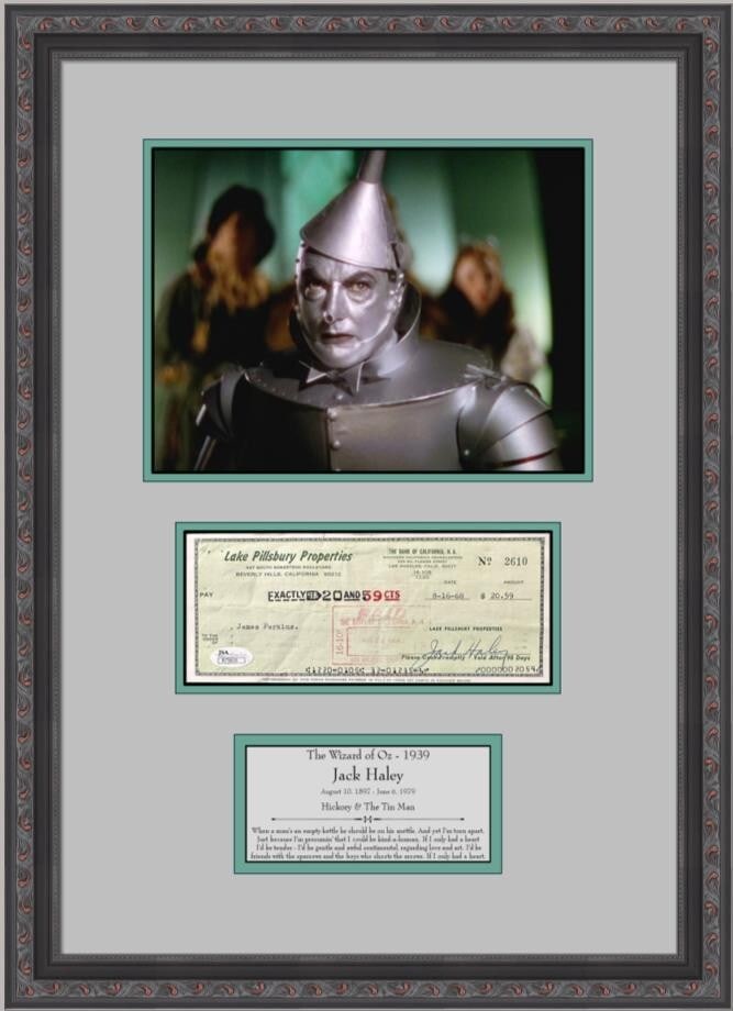 Jack Haley Tin Man Signed Photo Display Custom Framed Wizard of Oz JSA: Jack Haley Tin Man Signed Photo Display Custom Framed Wizard of Oz JSA This stunning display features a signed bank check from Jack Haley, known for his role as the Tin Man in the beloved film "The Wi