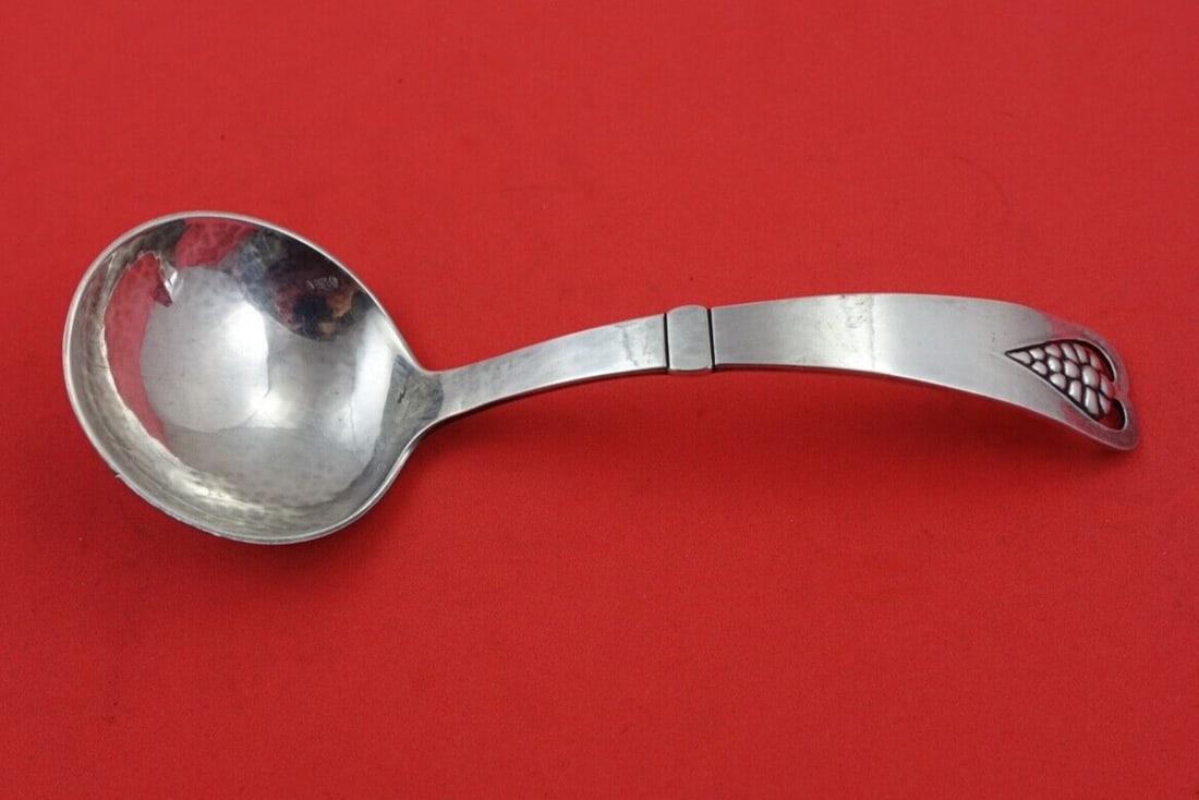 Georg Jensen Grape Sterling Silver Sauce Ladle 6 inch: Georg Jensen Grape Sterling Silver Sauce Ladle 6 inch This exquisite sauce ladle from the Grape pattern by Georg Jensen is crafted in high-quality sterling silver. Measuring 6 inches, it showcases the