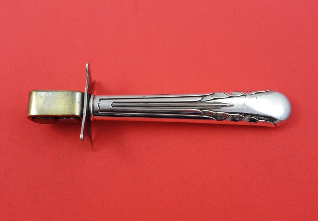 International Sterling Silver Orchid Knife Sharpener 7" with Wheels: International Sterling Silver Orchid Knife Sharpener 7" with Wheels This exquisite knife sharpener from the Orchid pattern by International is crafted from sterling silver and features convenient whee