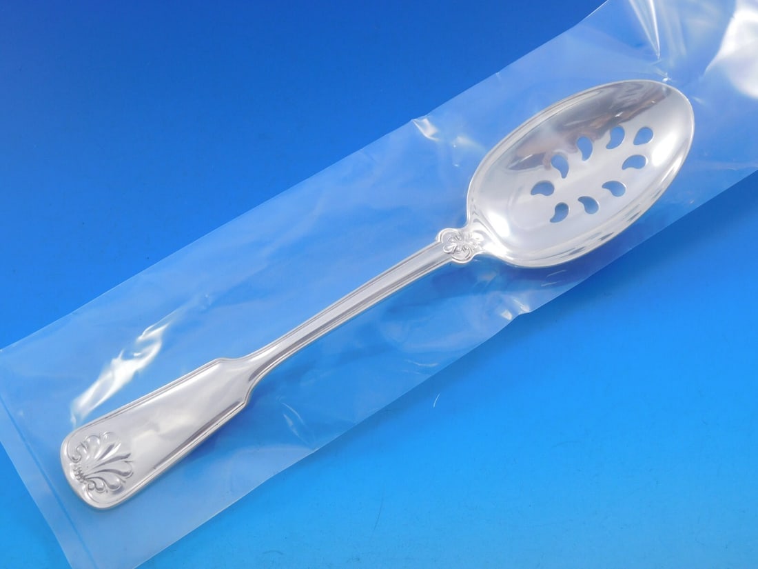 Tiffany & Co. Shell and Thread Sterling Silver Slotted Spoon 8.5" 9-Hole Custom: Tiffany & Co. Shell and Thread Sterling Silver Slotted Spoon 8.5" 9-Hole Custom This exquisite serving spoon from Tiffany & Co. features the iconic Shell and Thread pattern, a timeless design first in