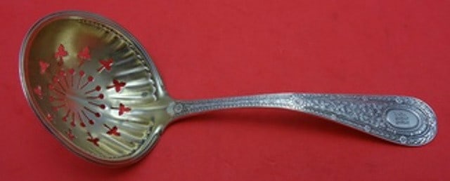 Whiting Laureate Sterling Silver Gold Washed Sugar Sifter Ladle 5.5": Whiting Laureate Sterling Silver Gold Washed Sugar Sifter Ladle 5.5" Introducing the Laureate by Whiting Sterling Silver Sugar Sifter Ladle, featuring a stunning gold wash finish. This exquisite piece