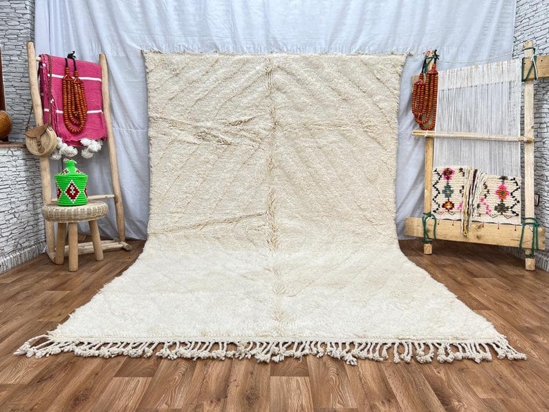 Handwoven Soft White Engraved Rug from Morocco 8 x 5 Feet: Handwoven Soft White Engraved Rug from Morocco 8 x 5 Feet Experience the elegance of this Stunning Soft White Engraved Rug, handwoven in the Atlas Mountains by skilled local Berber women weavers. Craf