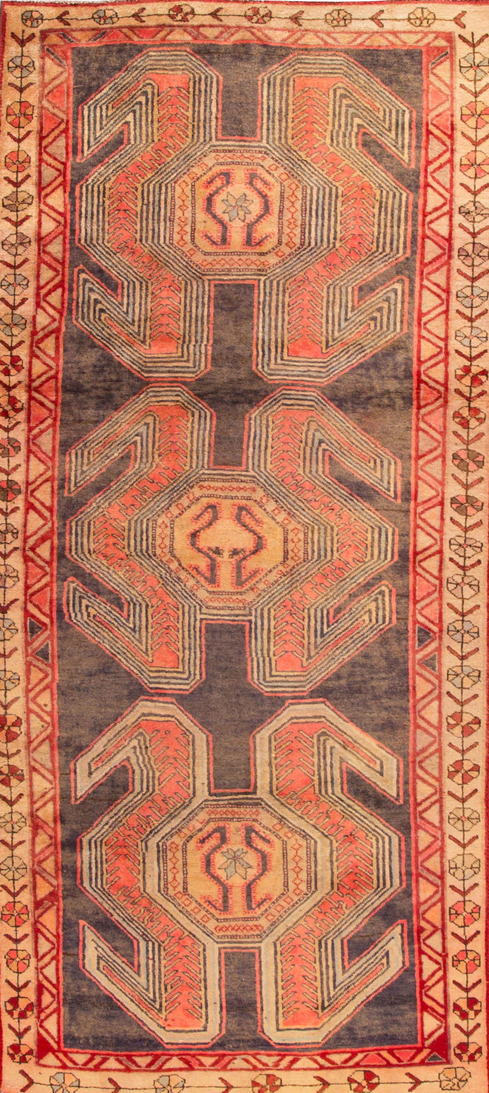 Vintage Kurdish Handmade Wool Rug Gray Geometric 3'8 x 8'8: Vintage Kurdish Handmade Wool Rug Gray Geometric 3'8 x 8'8 This stunning Vintage Kurdish Handmade Wool Rug showcases a captivating gray field adorned with vibrant orange and peach accents, featuring a