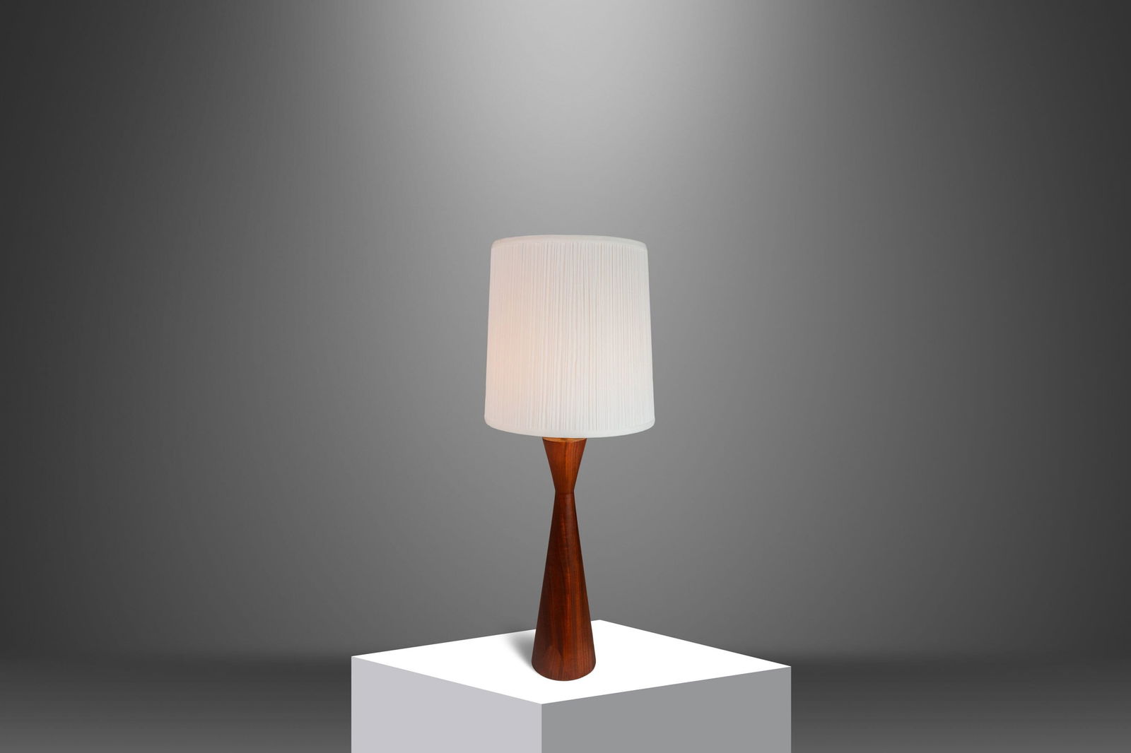 Mid-Century Modern Hourglass Table Lamp by Phillip Lloyd Powell in Solid Walnut: Mid-Century Modern Hourglass Table Lamp by Phillip Lloyd Powell in Solid Walnut This stunning Mid-Century Modern table lamp features a wood-turned hourglass design crafted from solid American black wa