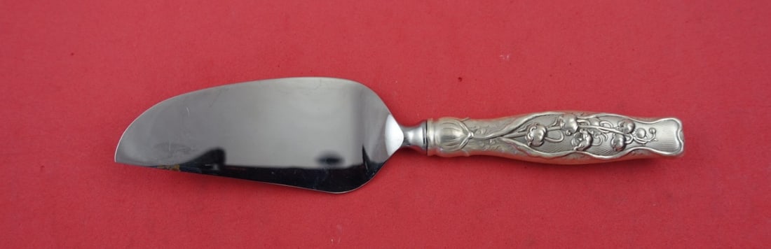 Whiting Lily of the Valley Sterling Silver Cheese Server 6.5": Whiting Lily of the Valley Sterling Silver Cheese Server 6.5" This exquisite cheese server is part of the renowned 'Lily of the Valley' pattern by Whiting, crafted from sterling silver. Patented in 18