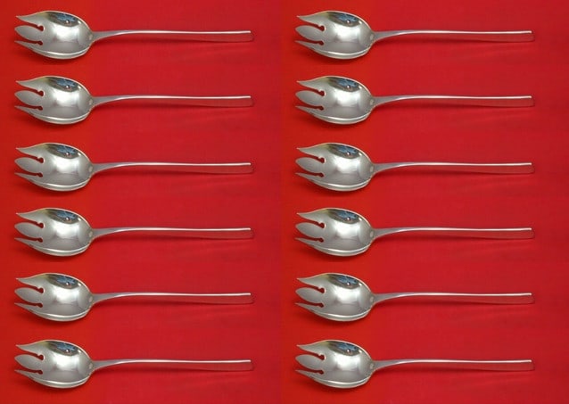 International Sterling Silver Vision Ice Cream Forks Set of 12pc 6 3/8": International Sterling Silver Vision Ice Cream Forks Set of 12pc 6 3/8" This exquisite set of 12 ice cream forks features the elegant Vision pattern by International Sterling. Each fork measures 6 3/8