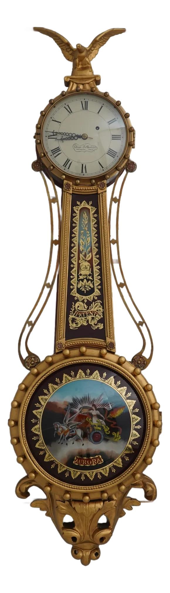 Elmer Stennes Girandole Banjo Clock with Aurora Glass 60 Years Old: Elmer Stennes Girandole Banjo Clock with Aurora Glass 60 Years Old Introducing the Elmer Stennes Girandole Banjo Wall Clock, a beautifully crafted timepiece with a rich history of approximately 60 yea