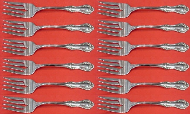 International Sterling Joan of Arc Salad Fork Set 12 pcs 6 1/8": International Sterling Joan of Arc Salad Fork Set 12 pcs 6 1/8" Introducing the exquisite Joan of Arc salad fork set from International Sterling, featuring 12 pieces each measuring 6 1/8 inches in len