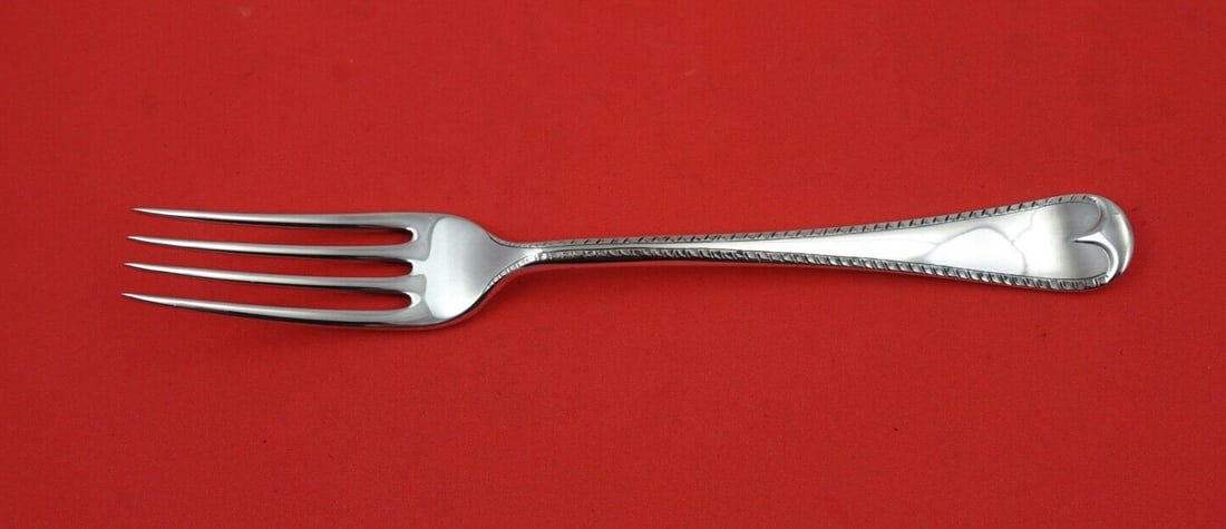 James Robinson Feather Edge Sterling Silver Dinner Fork 8 Inch 4 Tine: James Robinson Feather Edge Sterling Silver Dinner Fork 8 Inch 4 Tine This exquisite dinner fork features the elegant Feather Edge pattern by James Robinson, crafted from high-quality sterling silver.