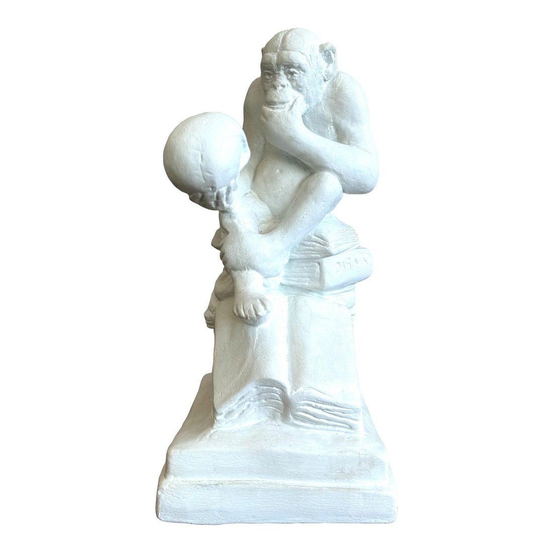 Vintage White Plaster Monkey Philosopher Sculpture: Vintage White Plaster Monkey Philosopher Sculpture This vintage white plaster statue features a monkey in a thoughtful pose, holding a human skull while seated atop an open book. With its unique desig