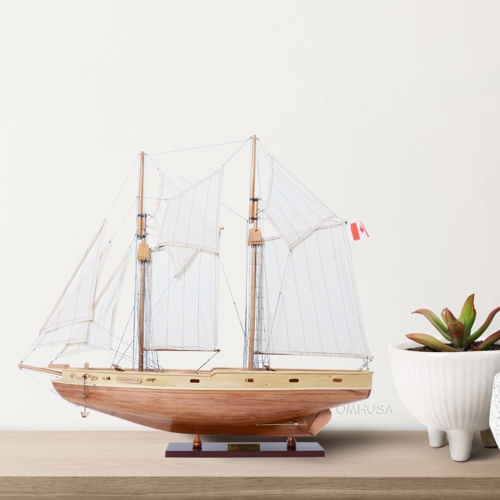 Bluenose II Wood Model Ship Nautical Decor 32.80H 38.50W 6.50D: Bluenose II Wood Model Ship Nautical Decor 32.80H 38.50W 6.50D This exquisite Bluenose II Ship Model captures the beauty of the iconic sailboat schooner with meticulous wood craftsmanship. Finished in