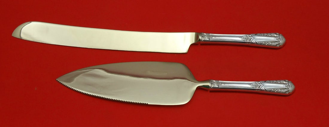 State House Sterling Silver Wedding Cake Set 2pc Custom Made: State House Sterling Silver Wedding Cake Set 2pc Custom Made This exquisite two-piece wedding cake set by State House is crafted from high-quality sterling silver, featuring a custom made hollow handl