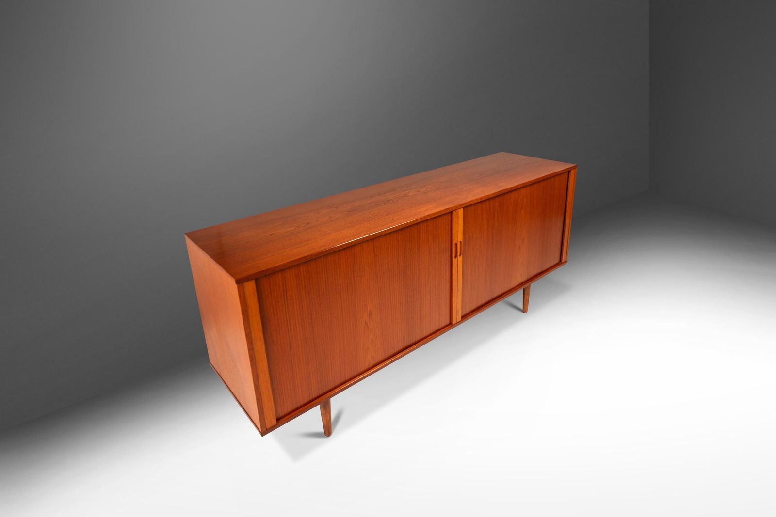 Danish Mid-Century Modern Credenza by Arne Vodder in Teak 1960s: Danish Mid-Century Modern Credenza by Arne Vodder in Teak 1960s Discover the remarkable craftsmanship of this expansive Danish Mid-Century Modern credenza, attributed to Arne Vodder and crafted in Den
