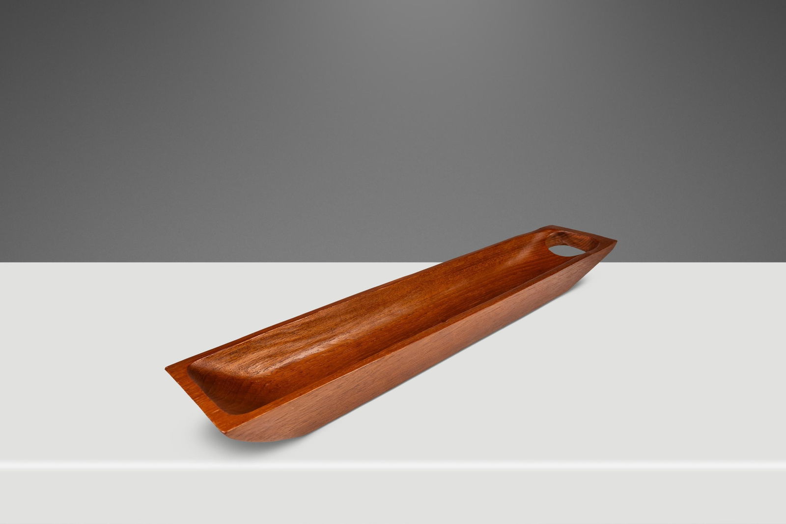 Vintage 1970s Organic Modern Teak Serving Tray Hand-Carved 22.25": Vintage 1970s Organic Modern Teak Serving Tray Hand-Carved 22.25" This stunning elongated serving tray is a perfect representation of Mid-Century Organic Modern design, hand-carved from solid Burmese